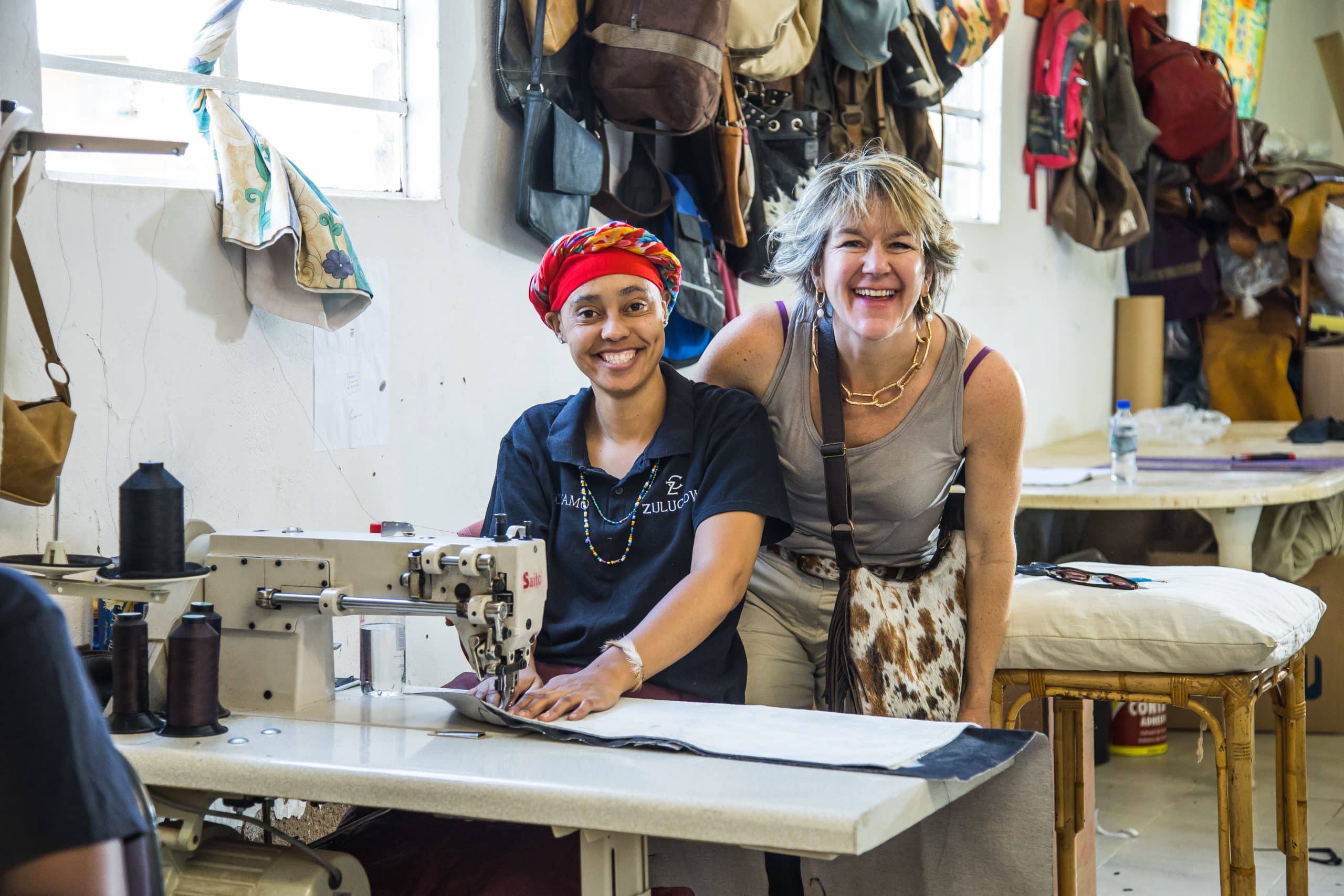 Working lady in work room, ethically-made, artisan-made, sustainable interiors, cowhide bags, cowhide rugs, sustainable, slow fashion,