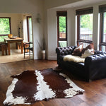 Nguni cowhide rugs, brown and white rugs, cowhides, skins, animal print, cowhide, luxury interiors, home interiors, interior styling, soft furnishings, sustainable, living room decor, floor art