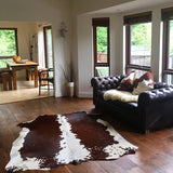 Nguni cowhide rugs, brown and white rugs, cowhides, skins, animal print, cowhide, luxury interiors, home interiors, interior styling, soft furnishings, sustainable, living room decor, floor art