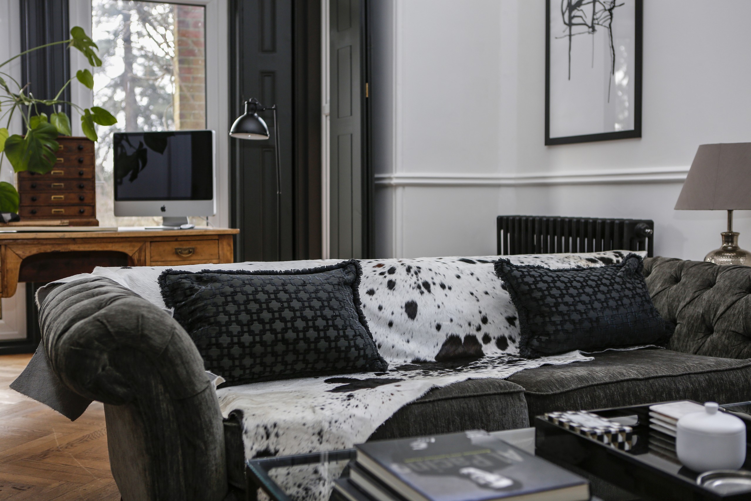 black and white cowhide rug, animal print, animal print sofa throw, rug, monochrome interiors, cowskin, soft furnishings, rugs, patterned rugs, living room decor
