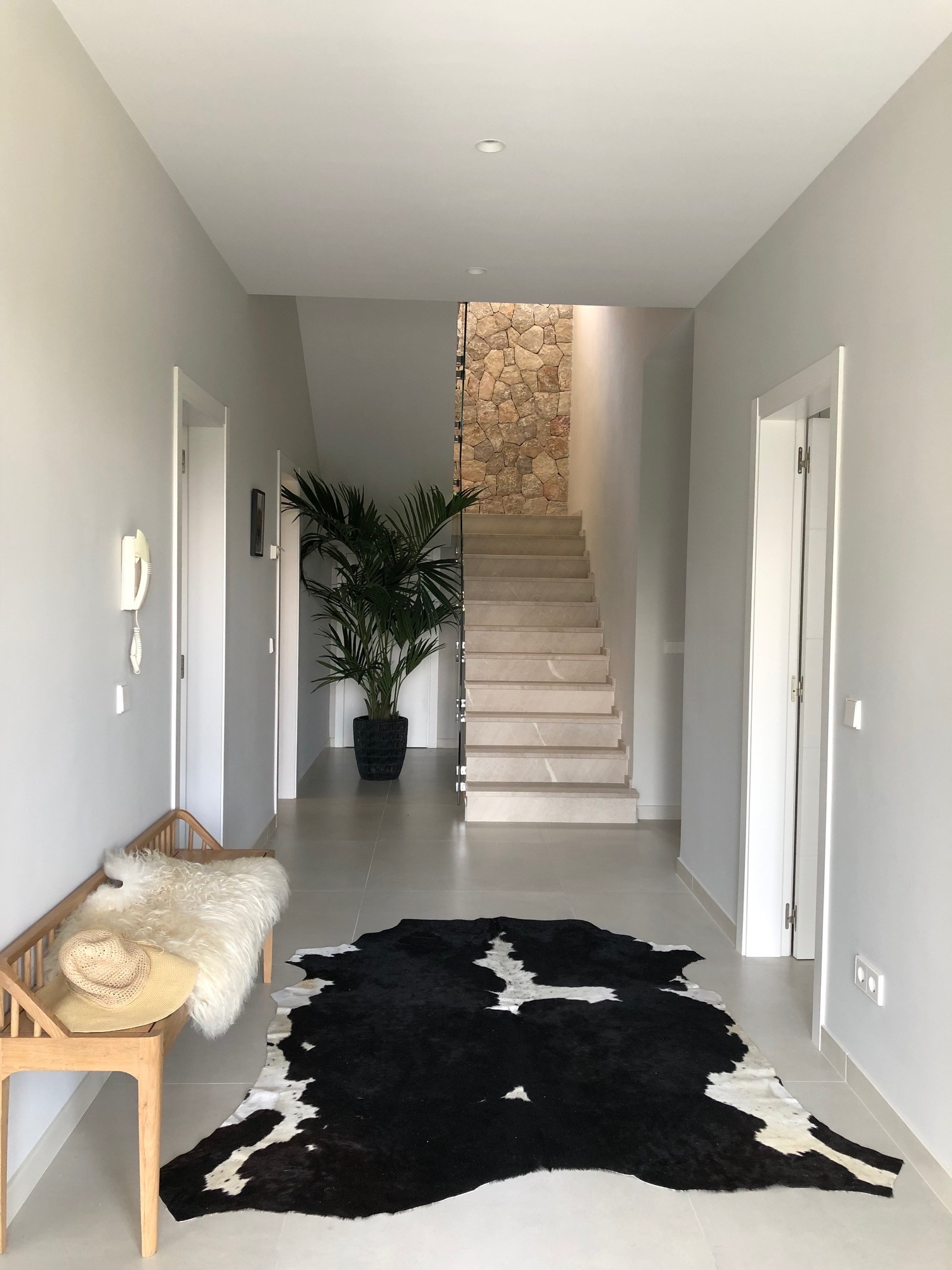 black and white Nguni cowhide rug, animal print rug, monochrome interiors, cowskin, hallway decor, soft furnishings, rugs patterned rugs, hall way decor