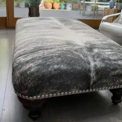 Nguni cowhide ottoman, footstool cowhide furniture, cowhide footstool, Nguni, interiors, custom made bespoke cowhide furniture, luxury interiors, interior design