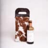 cowhide and leather wine bottle carrier, sustainable gifts, gifts for men.