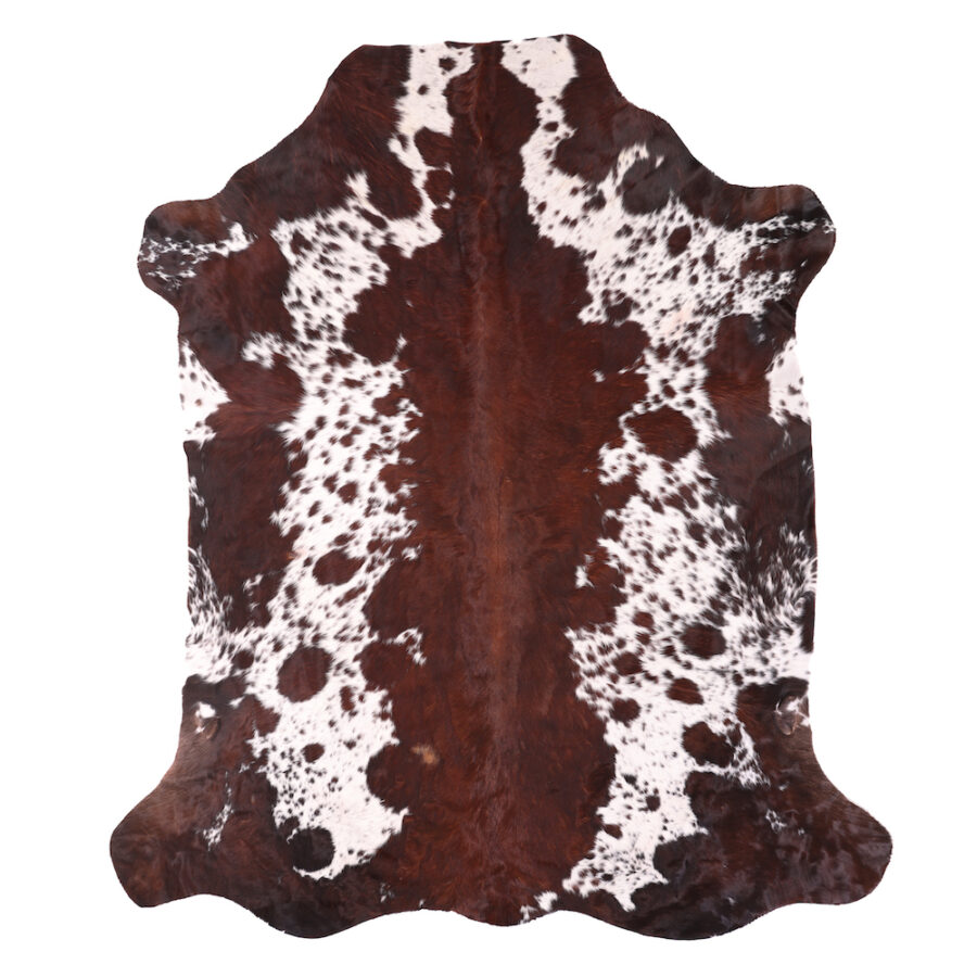 Brown and white Nguni cowhide rug with distinctive speckled pattern