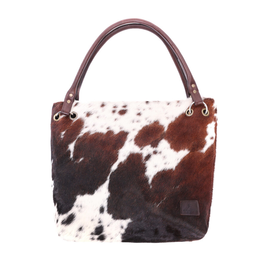 Handmade cow-print slouch bag – ethically crafted, sustainable cowhide leather handbag for a unique, luxury statement piece.