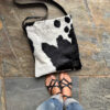 Sustainable cowhide messenger bag worn crossbody – Zulucow style