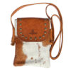 Boho mini cowhide phone bag made from genuine leather with western-inspired fringe and a compact design, perfect for festivals or everyday essentials