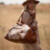 Hand-made, luxury, leather and cowhide travel bag or duffel bag for weekends away
