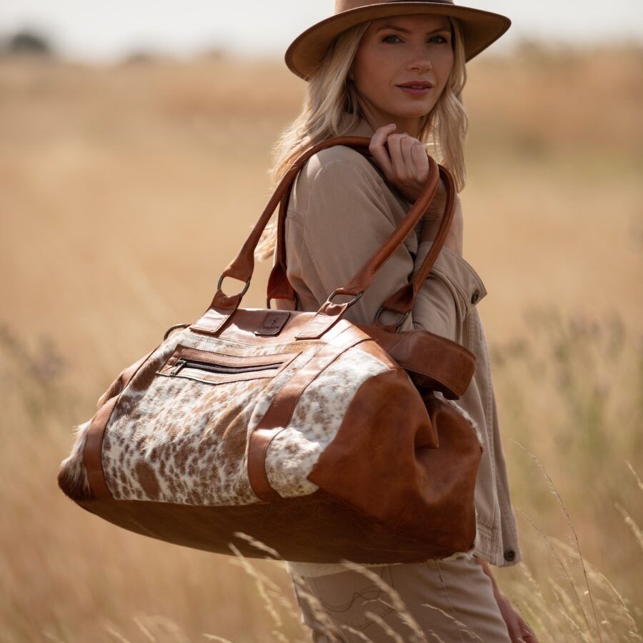 Hand-made, luxury, leather and cowhide travel bag or duffel bag for weekends away