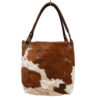 Handmade sustainable cowhide slouch bag by Zulucow, ethically crafted by Zulu artisans, natural cowprint leather shoulder bag